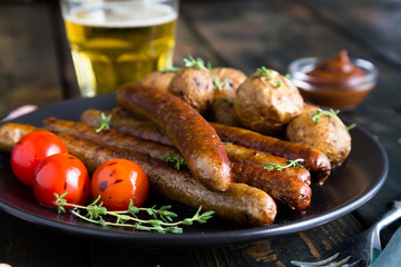 Fried sausages with baked potatoes