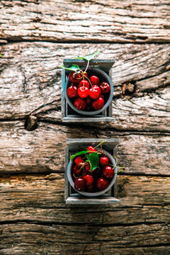 Fresh cherries on wood