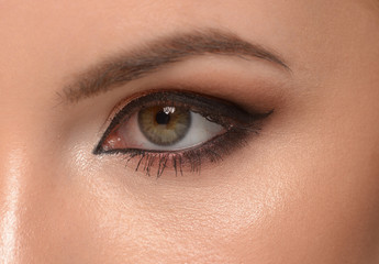 Fototapeta na wymiar Closeup of beautiful woman eye with makeup, eyeliner