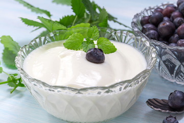 Delicate yogurt with blueberries and melissa