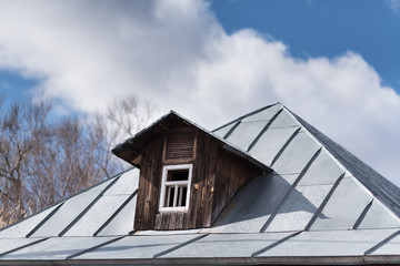 Fototapeta na wymiar Triangular skylight of an attic
