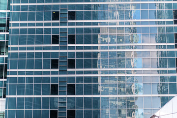 window reflections at the glass facade of an office building