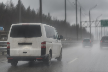 Traffic on highway on a foggy rainy day