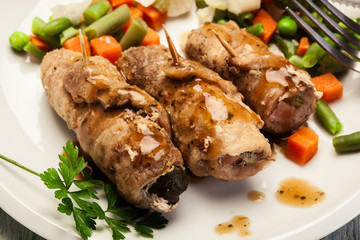 Pork rolls and vegetables