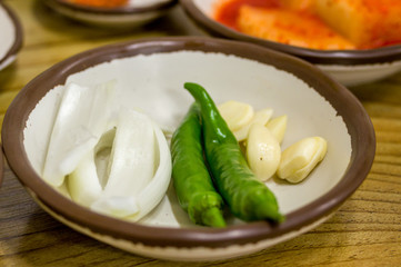 appetizers, onion slices, green peppers and garlics, for sundae gukbap, Korean blood sausage stew