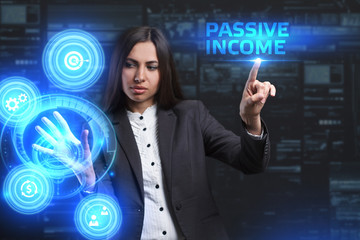 The concept of business, technology, the Internet and the network. A young entrepreneur working on a virtual screen of the future and sees the inscription: Passive income