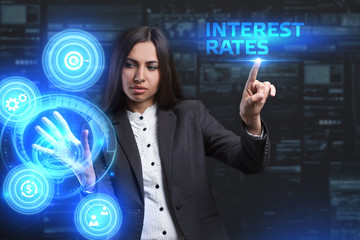 The concept of business, technology, the Internet and the network. A young entrepreneur working on a virtual screen of the future and sees the inscription: Interest rates