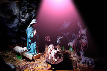 Christmas, Infant Jesus lying in manger in rays of divine light