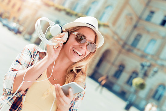Joyful woman listening to music