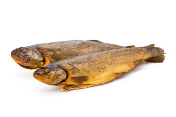 Smoked trout in front of a white background.