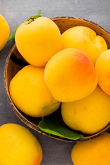 Apricots on a grey metal background.