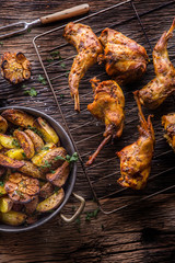 Rabbit. Roasted rabbit slices with american potatoes garlic spices salt,pepper cumin and draft beer. Hunting cuisine.