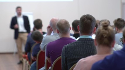 Lecturer speaking to his class in the lecture hall at the university