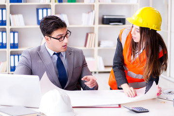 Construction foreman supervisor reviewing drawings