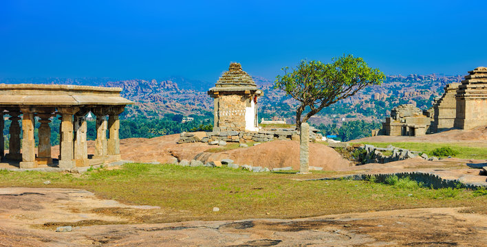 View from Hemakuta hill sunset point with ancient ruins, Hampi, Karnataka, India. Landscape with unique mountain formation with amazing stones, tropical nature and temple. UNESCO World Heritage Site