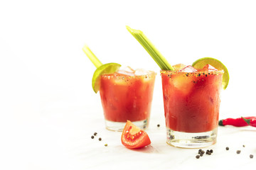 Bloody Mary cocktails with celery and lime