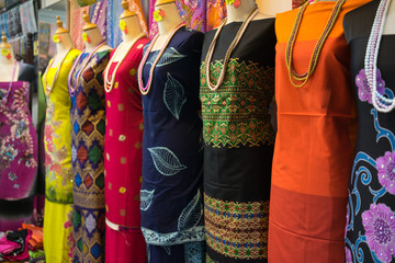 Various design of batik painting hanging in craft shop in Kuala Terengganu, Malaysia.