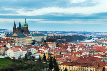 Naklejka na ściany i meble Panorama of the city Prague. Red tiled roofs of the houses in the old part of the city. Aerial view