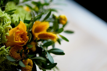Yellow bouquet with green carnation,in the composition of chrysanthemums, roses and dyed grains