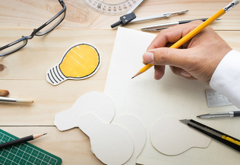 Top view of male hand on wood table with elements of tools,equipment.Creativity decoration design...
