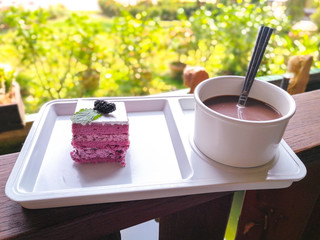 Blueberry cake and empty coffee.