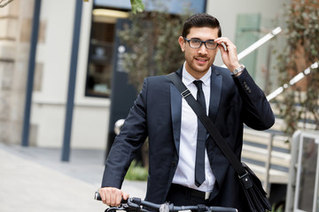 Young businessmen with a bike