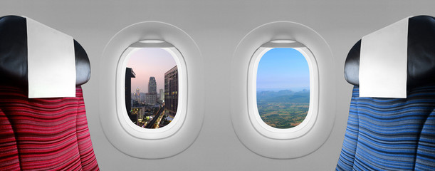 Two views in windows plane (city and mountain) with blue and red seats