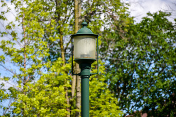 The old green lantern in the park of Canada