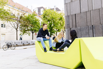 Young people sitting on the lounge seats in Vienna