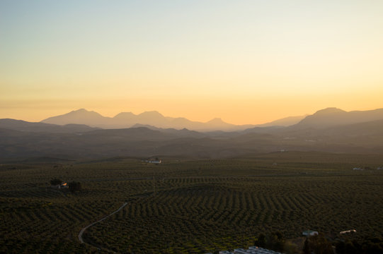 Panoramic and idyllic Andalusian landscape, mountain village Alcaudete at sunset