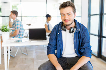 Fototapeta premium Young man working in office