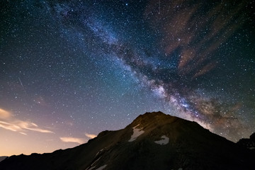 The colorful glowing core of the Milky Way and the starry sky captured at high altitude in...