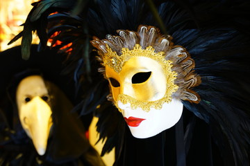 Colorful Venetian carnival mask on the street in Venice