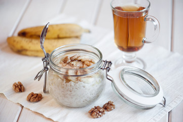 Oatmeal with banana and walnuts for breakfast