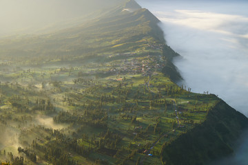 Cemoro Lawang in foggy moment during sunrise  in East Java, Indonesia.