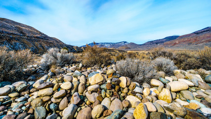 Thompson River flowing through semi desert landscape of the Thompson River Valley viewed from...