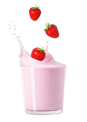 milk in glass with splash and strawberry 