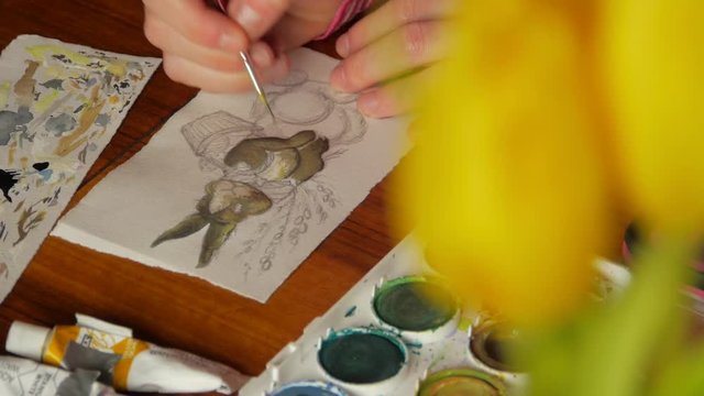 female artist painter painting a picture of a easter bunny