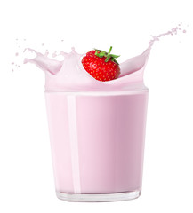 strawberry falling into milk