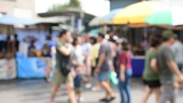 Blur Many Buyers in a Shopping Street at Chatuchak Market of Thailand