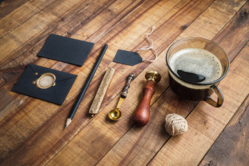 Vintage stationery set. Photo of blank stationery on wooden table background. Mockup for branding...