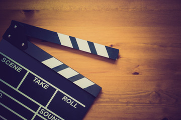Obraz premium movie clapper on wood table