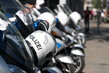 Berlin, Germany - May 31, 2017: German police helmets resting on the handlebars of motorcycles