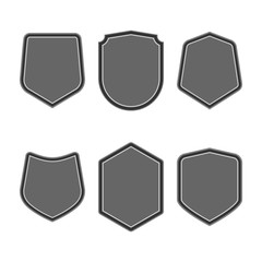 Set of black shields in trendy flat style isolated on white background. Herald logo and medieval Shield symbol for your web site design, logo. Vector illustration. EPS10.