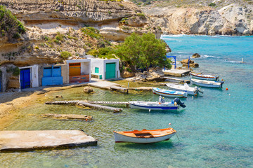 Fototapeta na wymiar Picturesque fishing village of Mandrakia with traditional shelters for the boats (sirmata) , Milos Island. Greece.