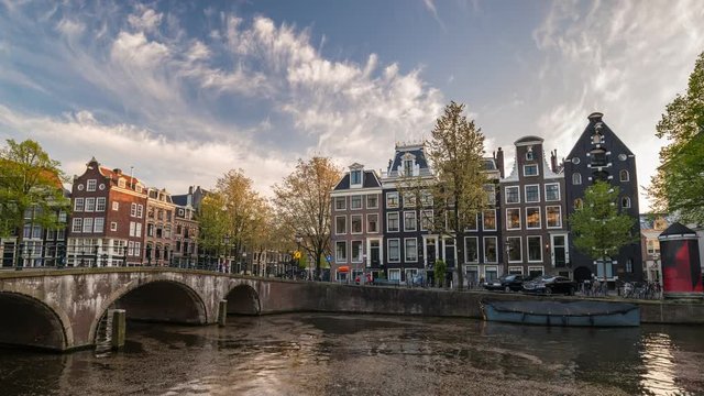 Amsterdam city skyline sunset timelapse at canal waterfront, Amsterdam, Netherlands, 4K Time Lapse