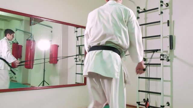 A man is practicing and doing karate exercises 4k
