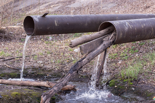 pipes pouring mud water pollution