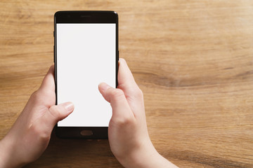 female teen hand using smartphone with blank white screen, shallow focus