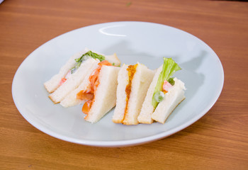 delicious sandwich with ham vegeable bread on  white dish , home made sandwich, health food